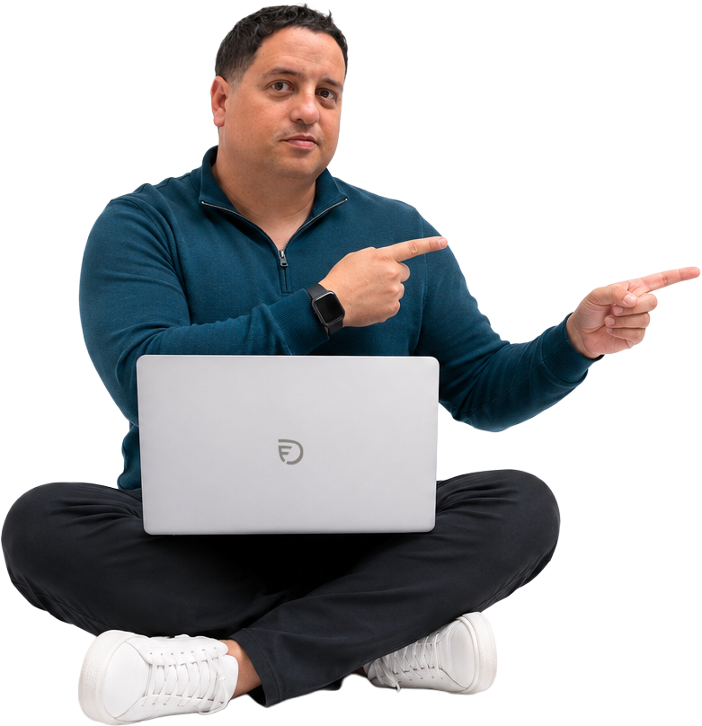Fidel Duran sitting with a laptop, pointing toward the contact information